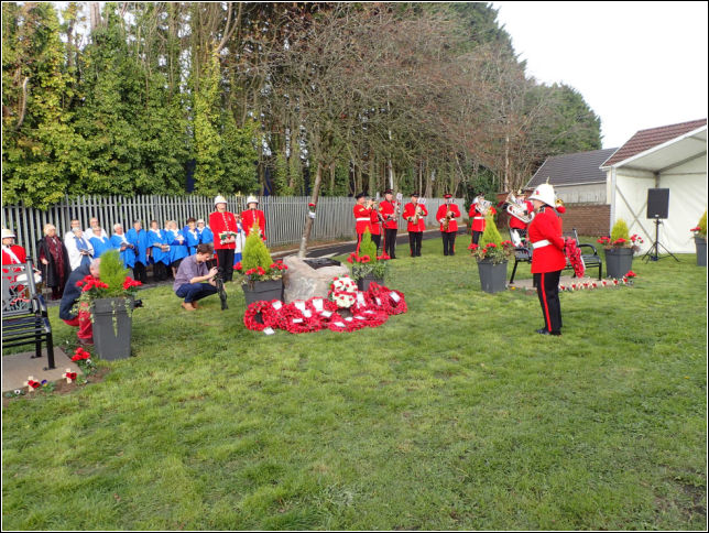 A member of the band stands in silence and respect A member of the band stands in silence and respect
